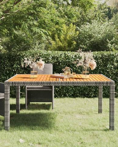 Petromila vidaXL Záhradný stôl 150x90x75 cm polyratan a akáciové drevo sivý